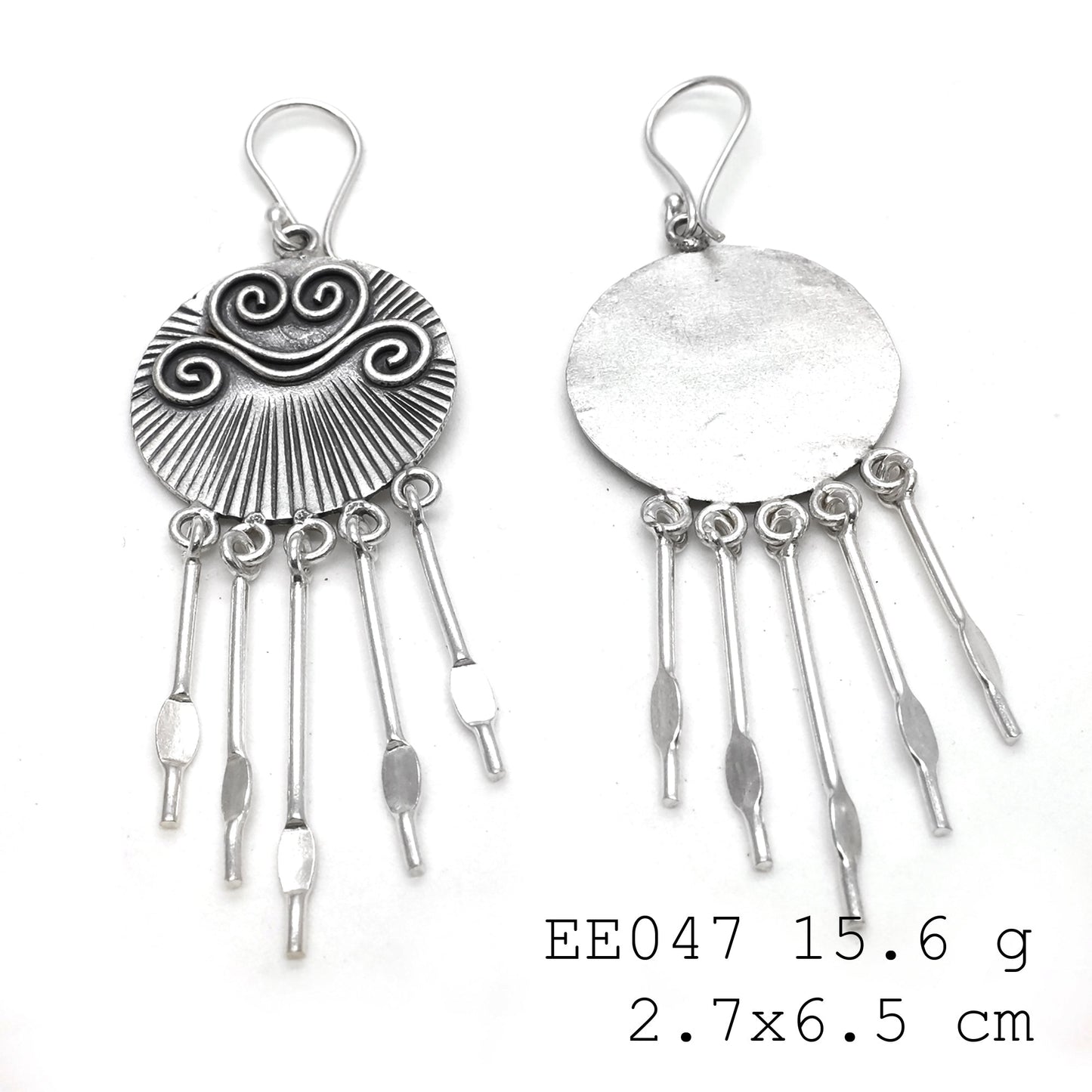 Twisting up my style game with new silver earrings.