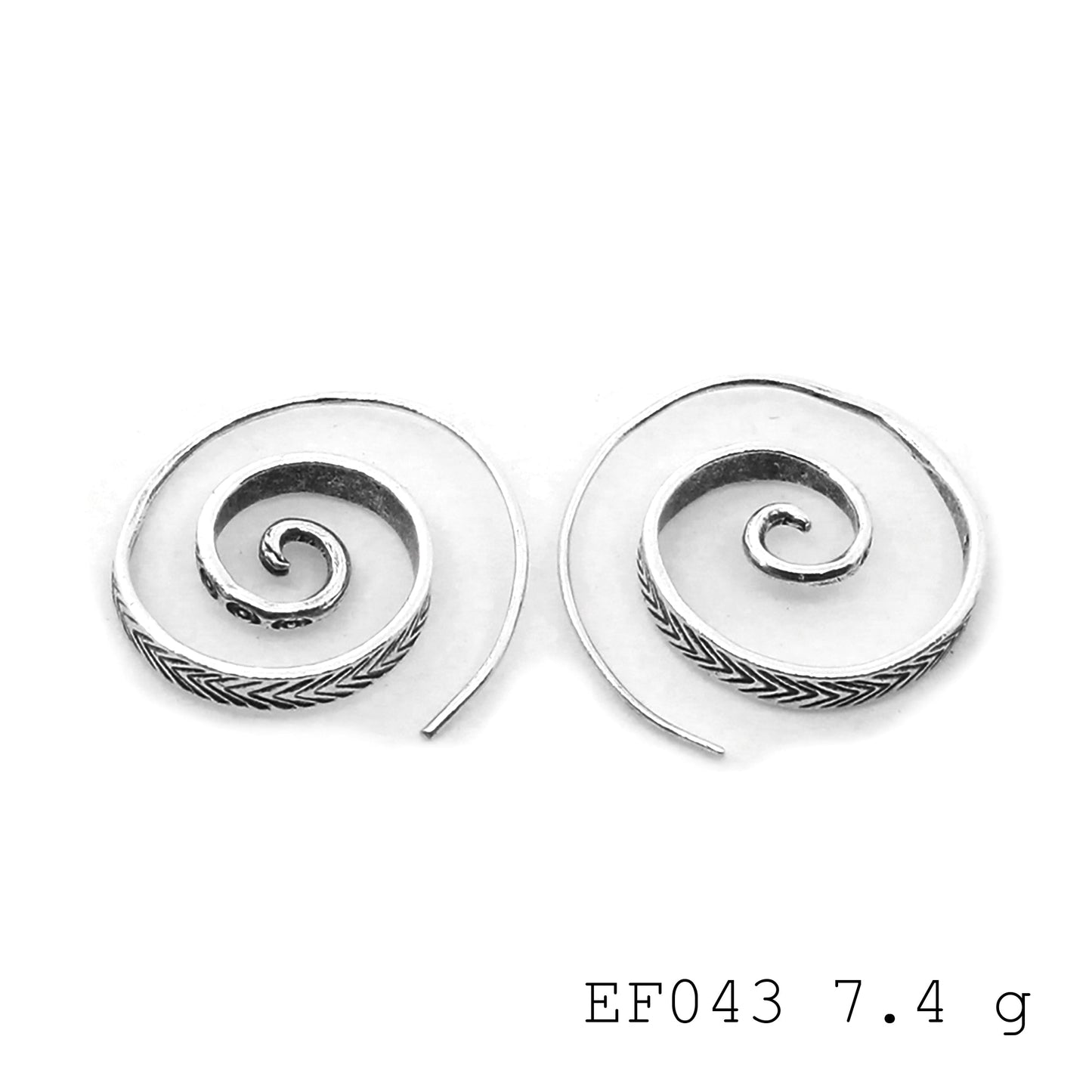 Spiraling into the weekend with these perfect silver earrings.