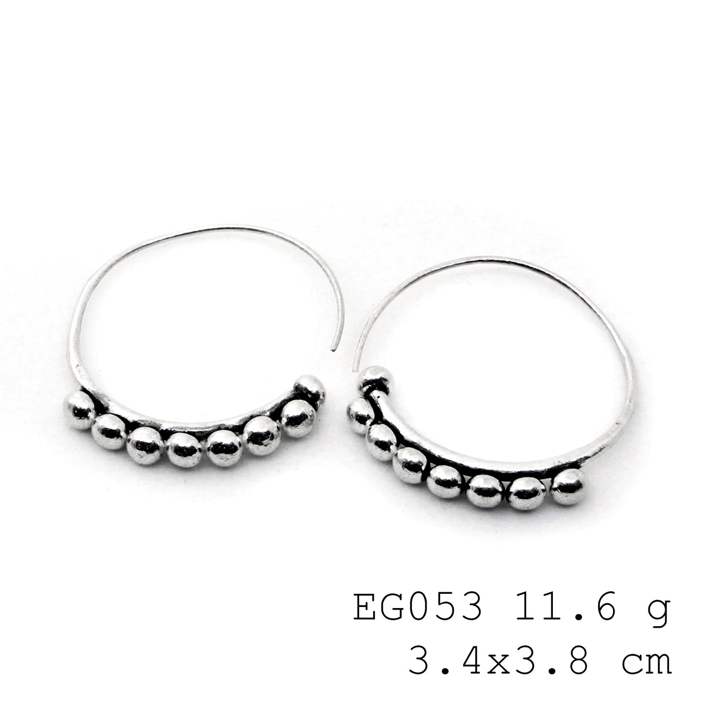 From the bench to you: handmade silver earrings.