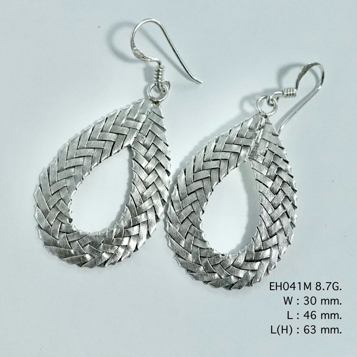 Woven by hand, worn with love: silver earrings.