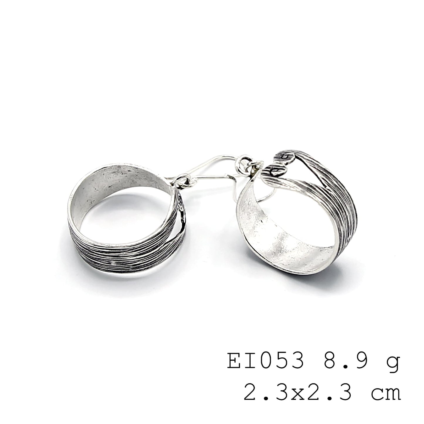 Hand-sculpted bag silhouettes in pure silver earrings.