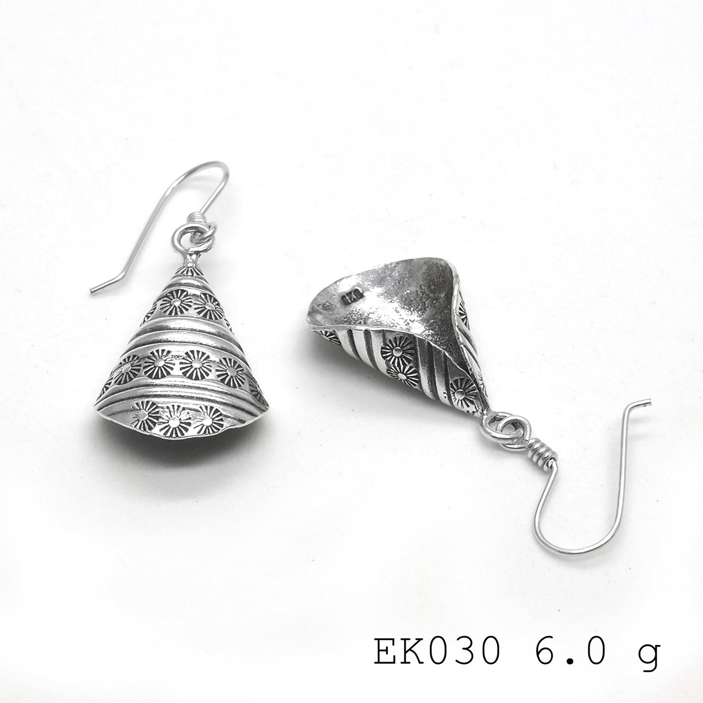 The perfect daily drop: funnel-shape silver earrings.