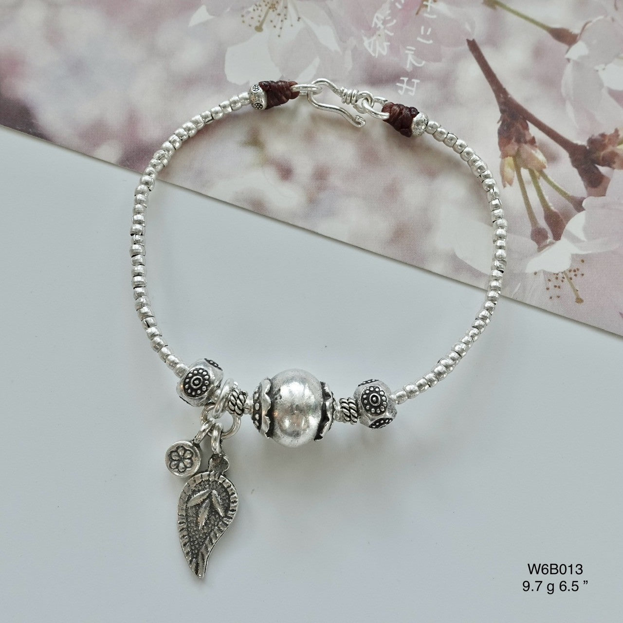 Minimalist luxury made accessible — silver bracelet, now discounted.