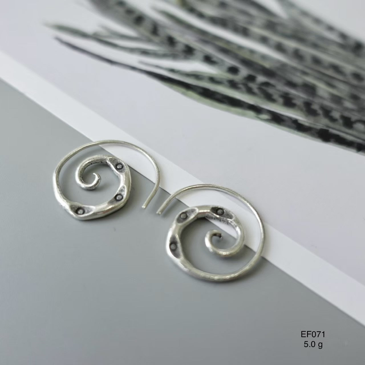 Elevate your look with pure silver earrings.