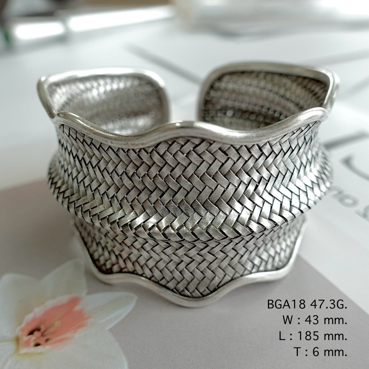 Handmade silver bangle, timeless shine.