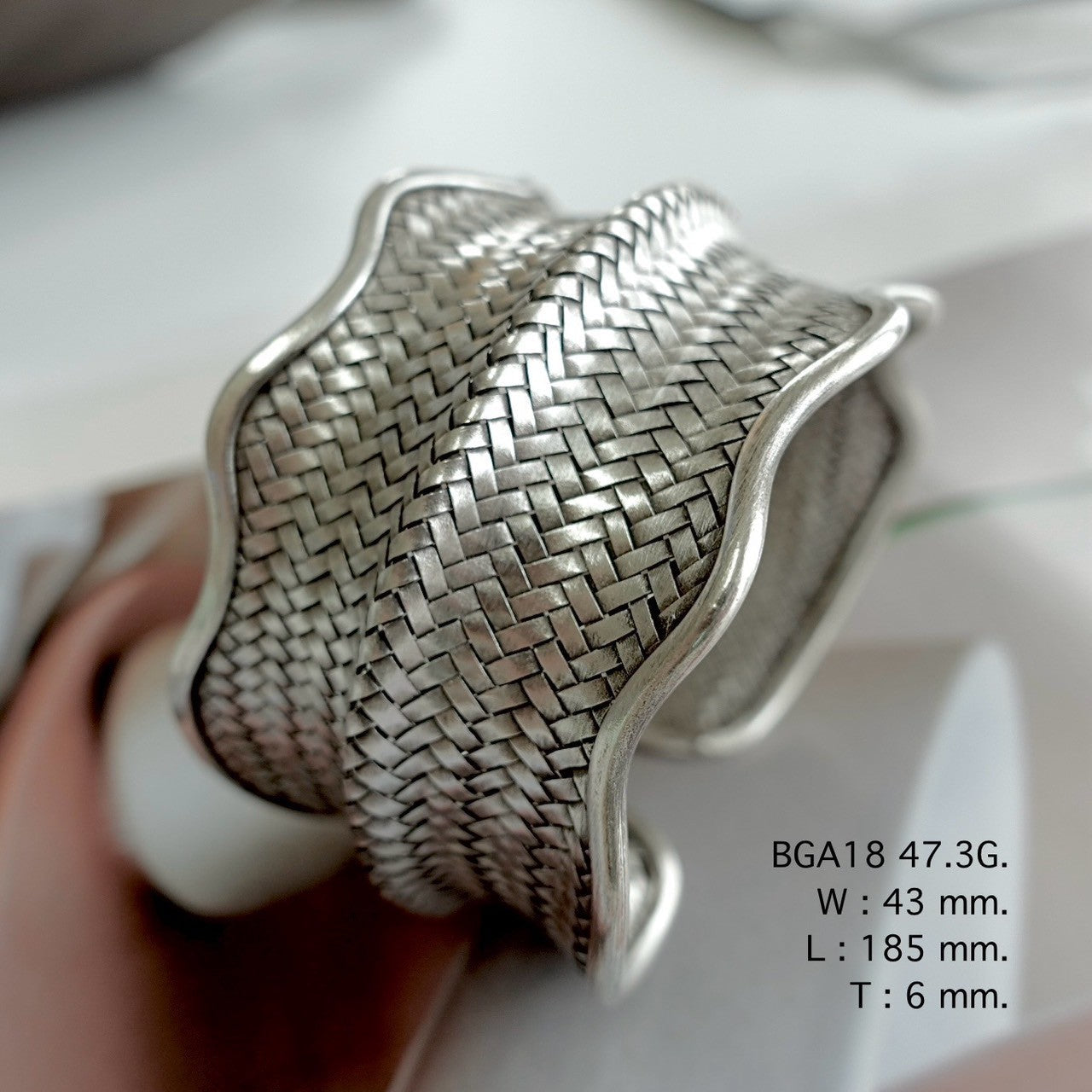 Handmade silver bangle, timeless shine.