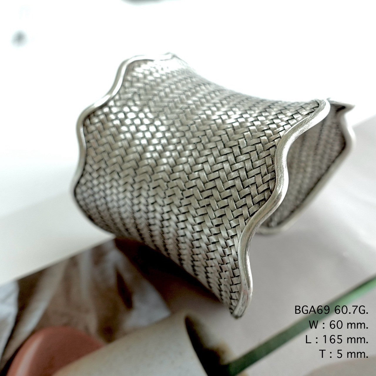 Wrap your wrist in a silver bangle.