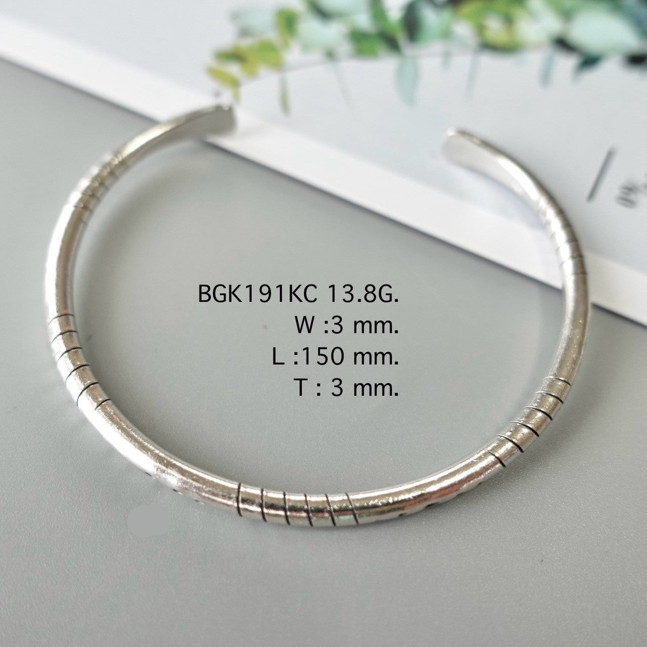 Simplicity shines in a silver bangle.