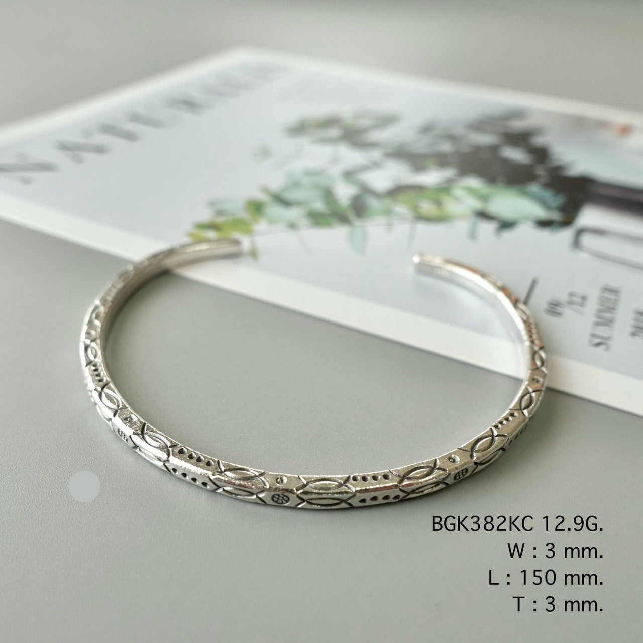 Light on the wrist, rich in charm — bangle.