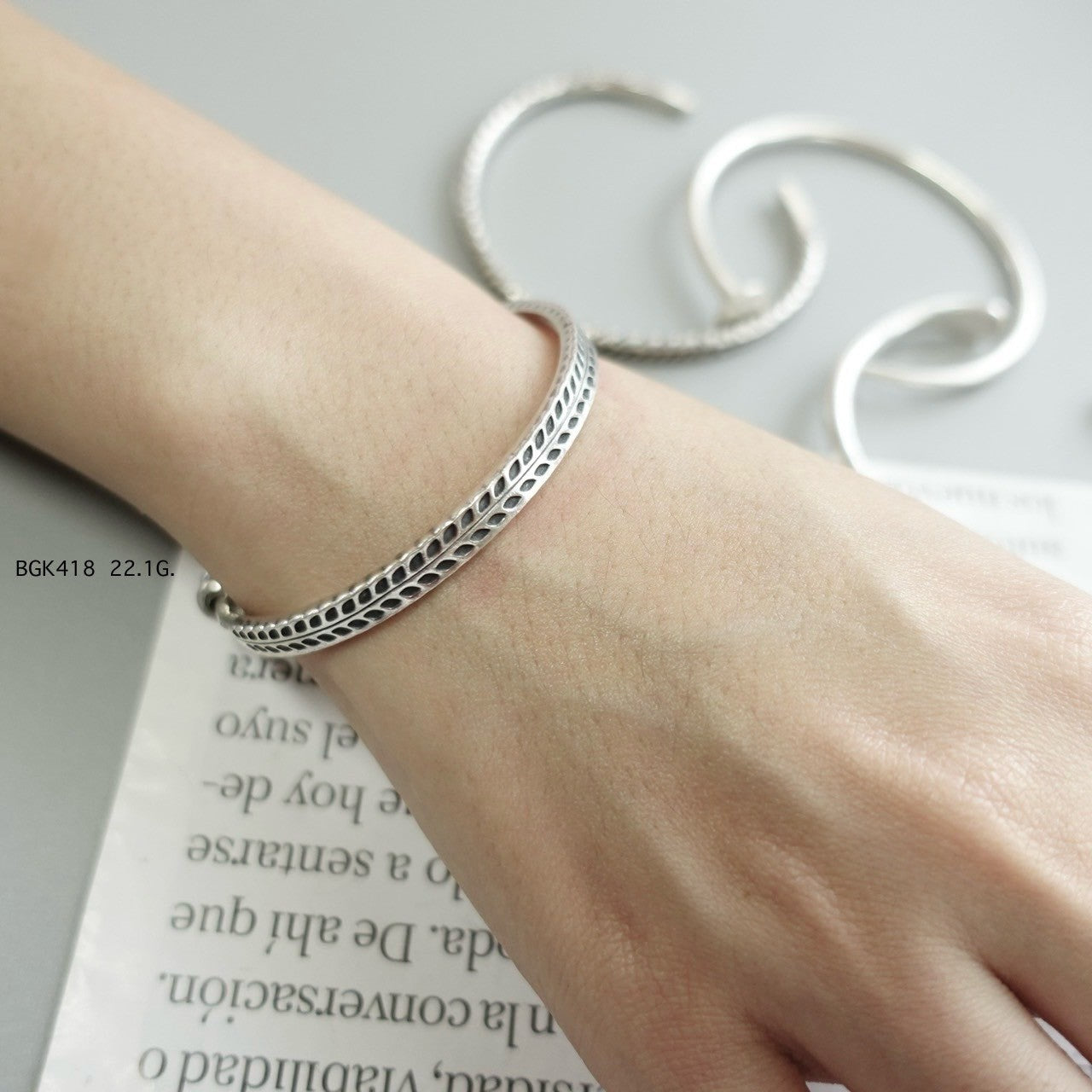 Silver bangle. Luxury, rooted in tradition.