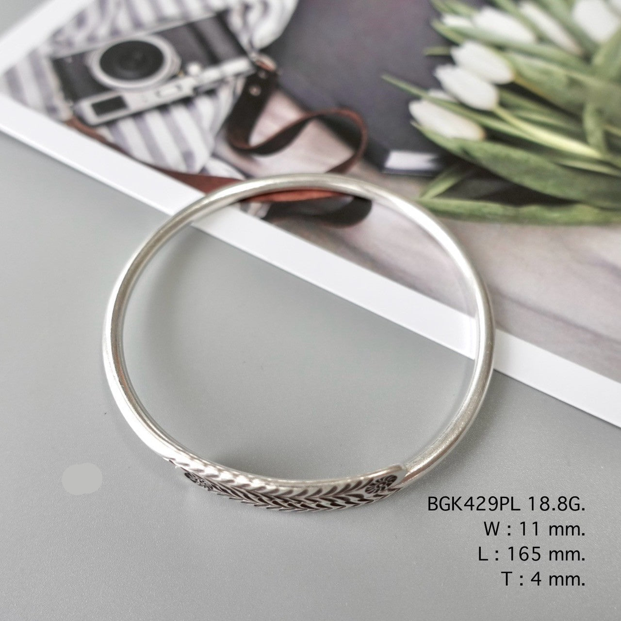 Grace your wrist with a silver bangle.
