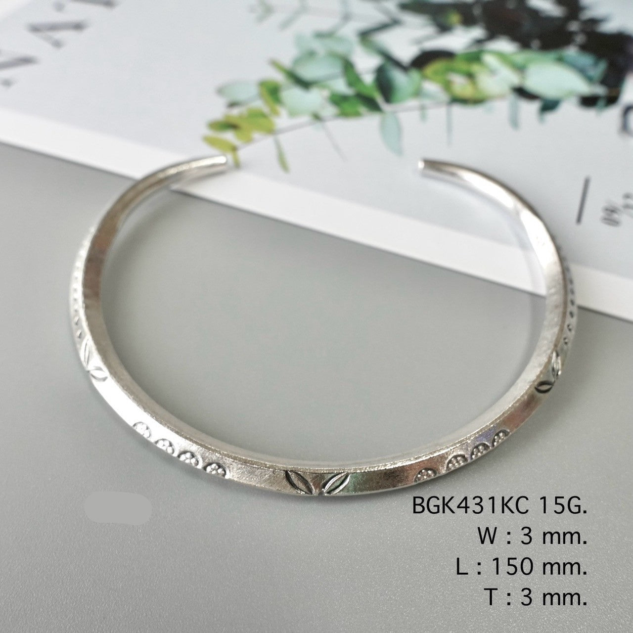 Your shine begins with this silver bangle.