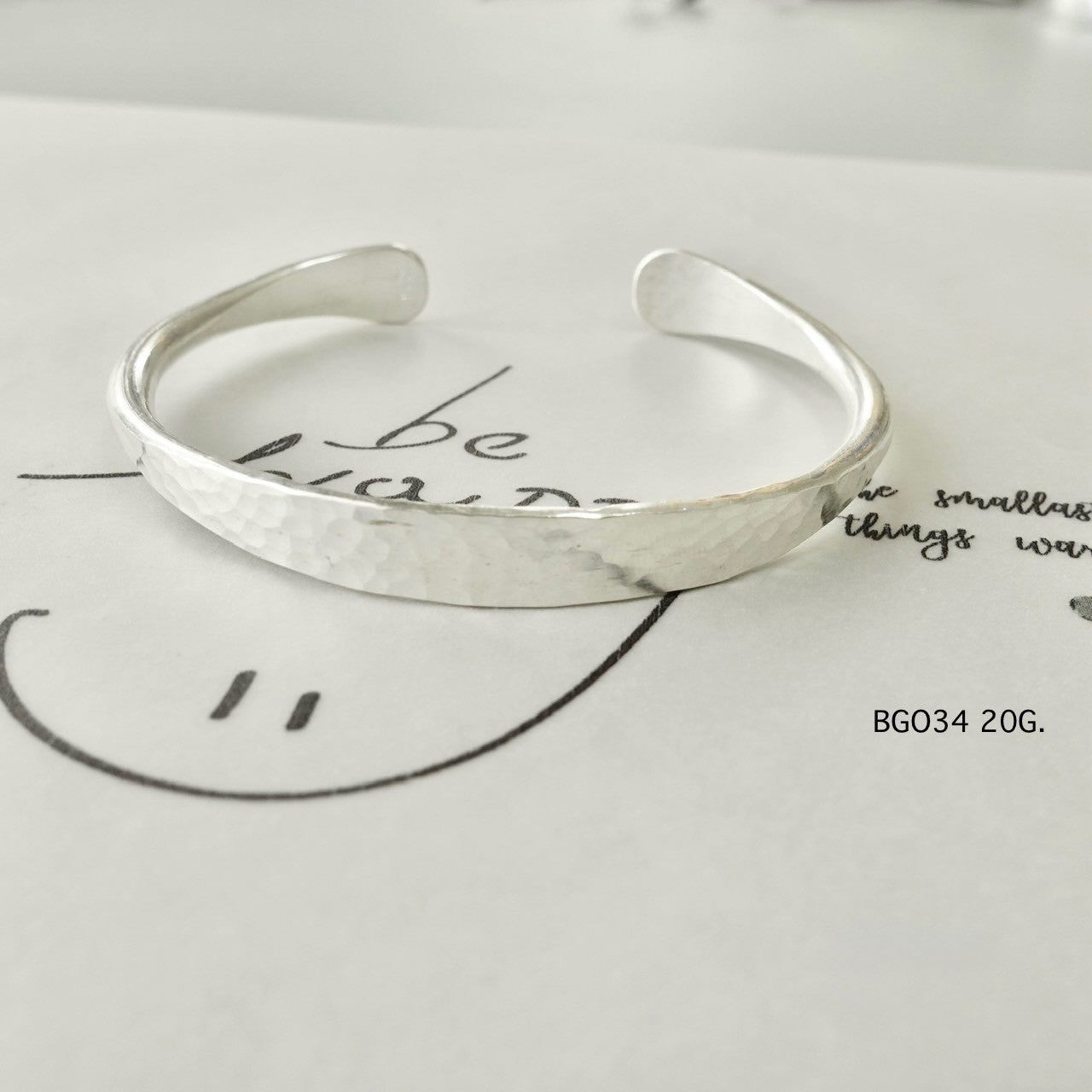 Silver bangle. Crafted to captivate.