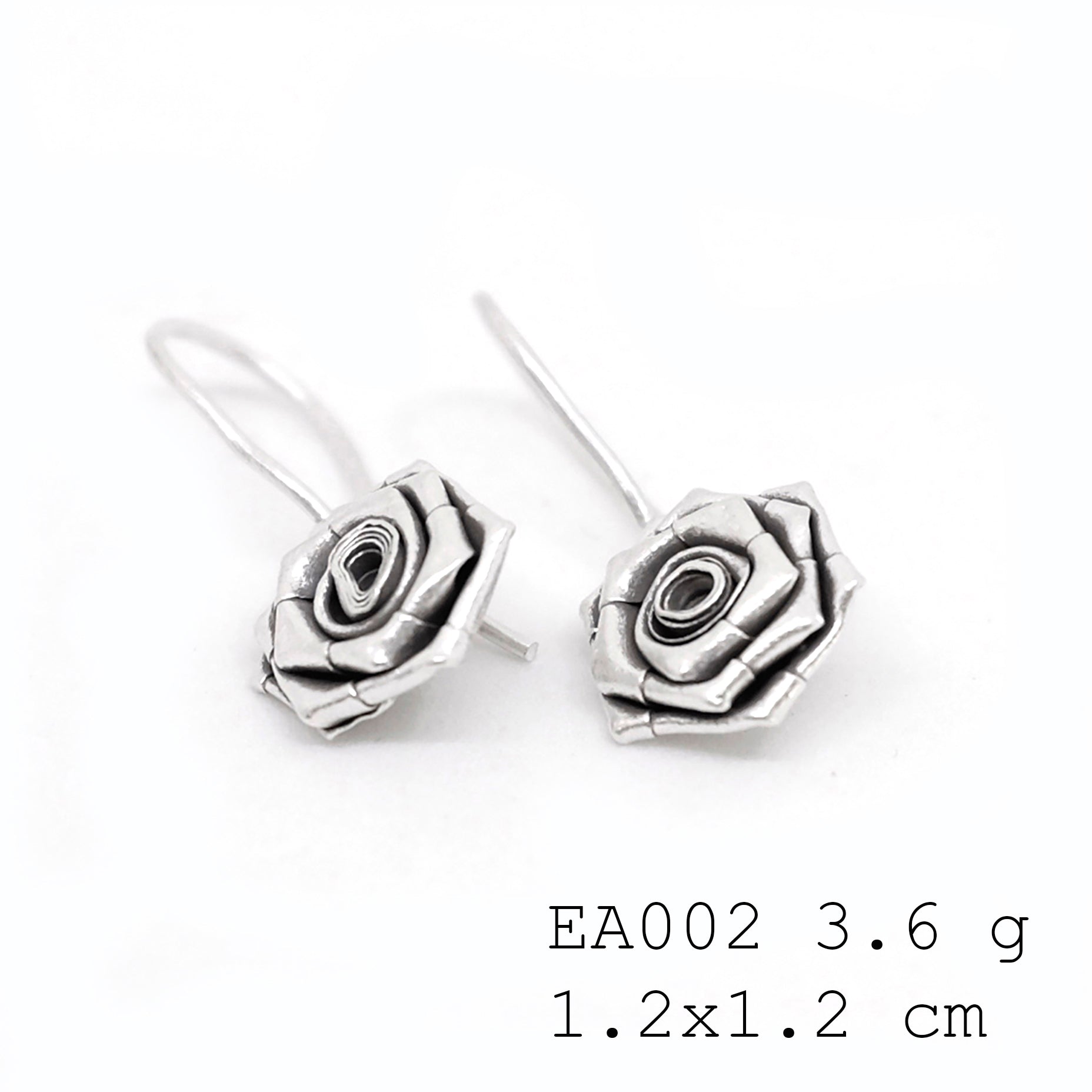 Nature-inspired silver earrings.