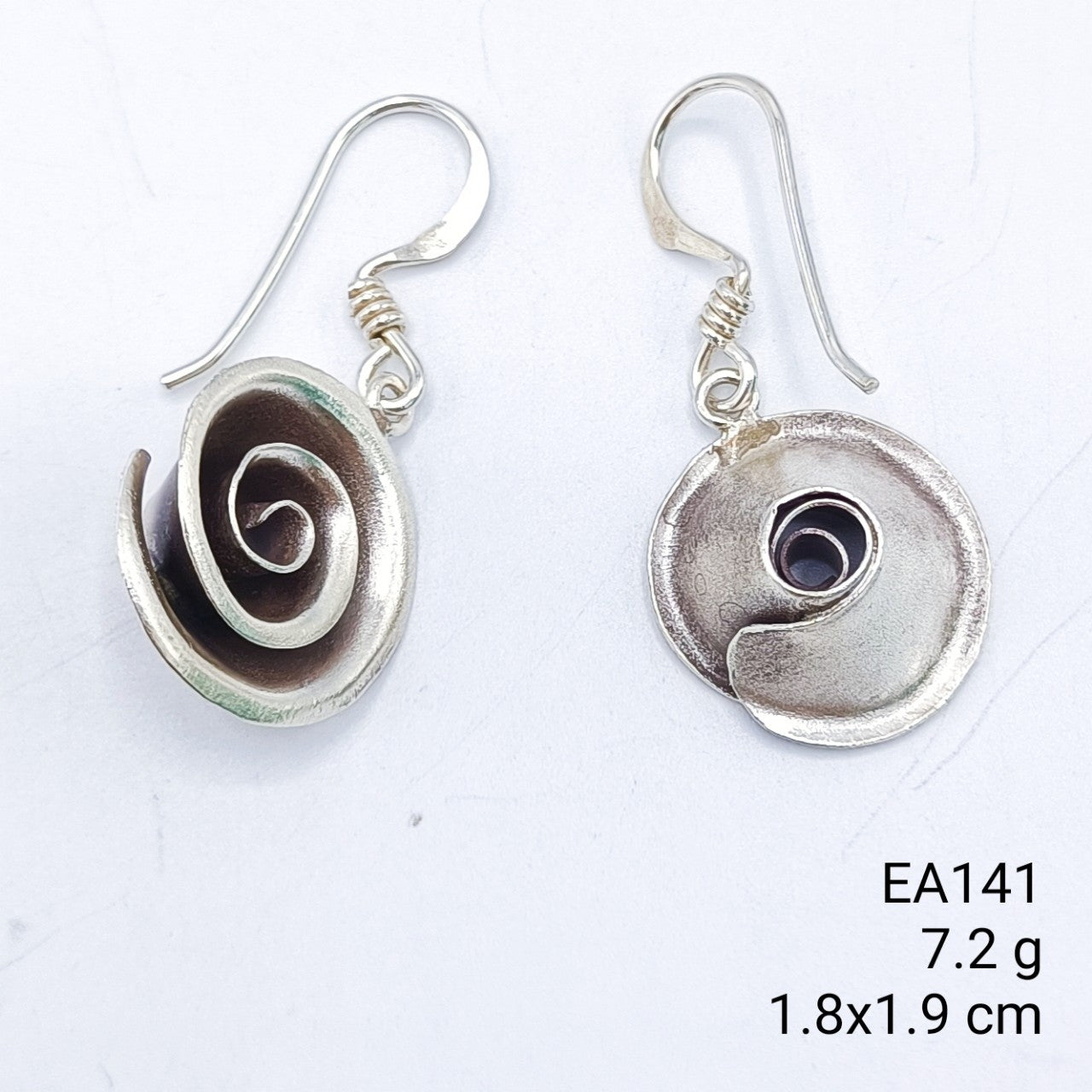 Hand-formed floral silver earrings.
