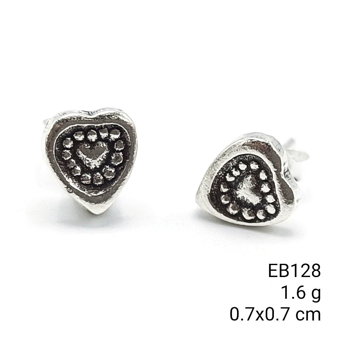 Every detail carved by hand. Tiny earrings.