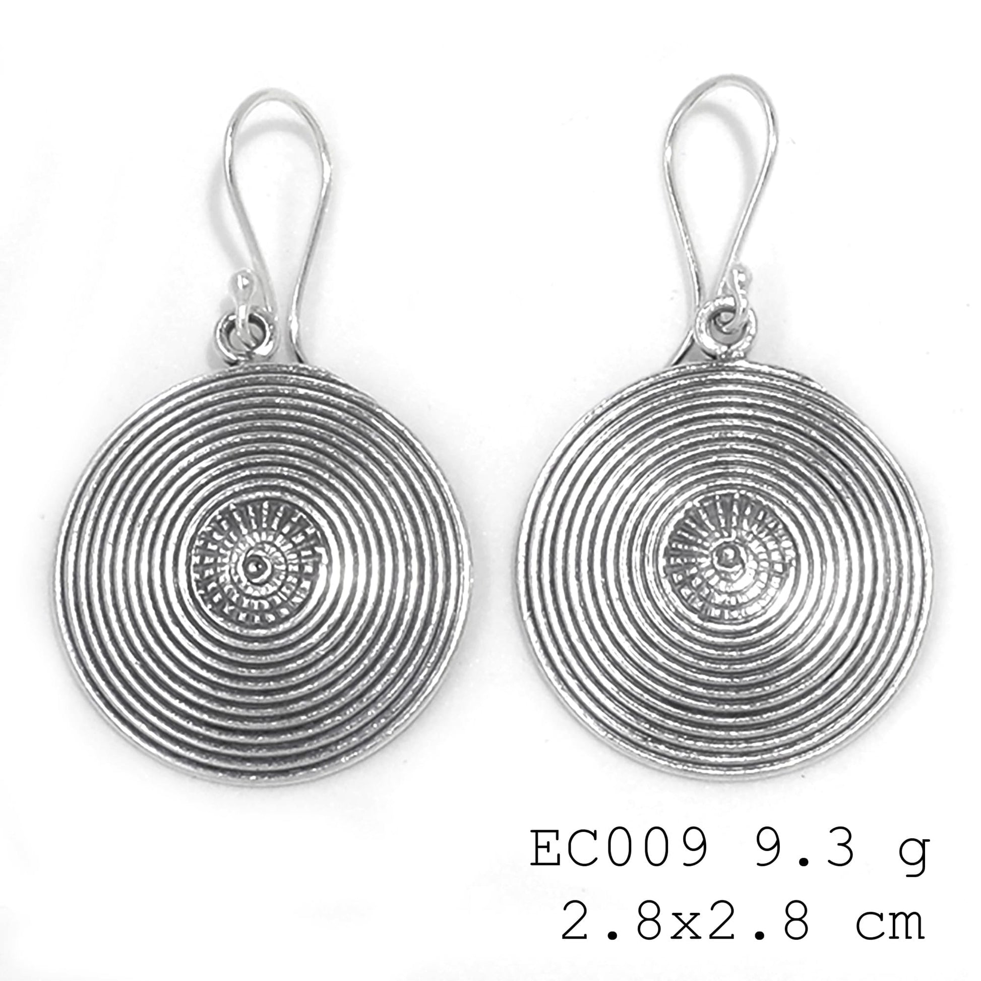 One-of-a-kind treasures. Snail Coin silver earrings.