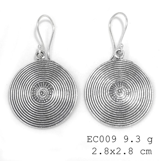 One-of-a-kind treasures. Snail Coin silver earrings.