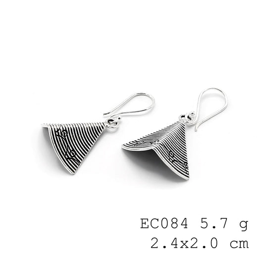 Tiny treasures: Handmade Snail Coin silver earrings.