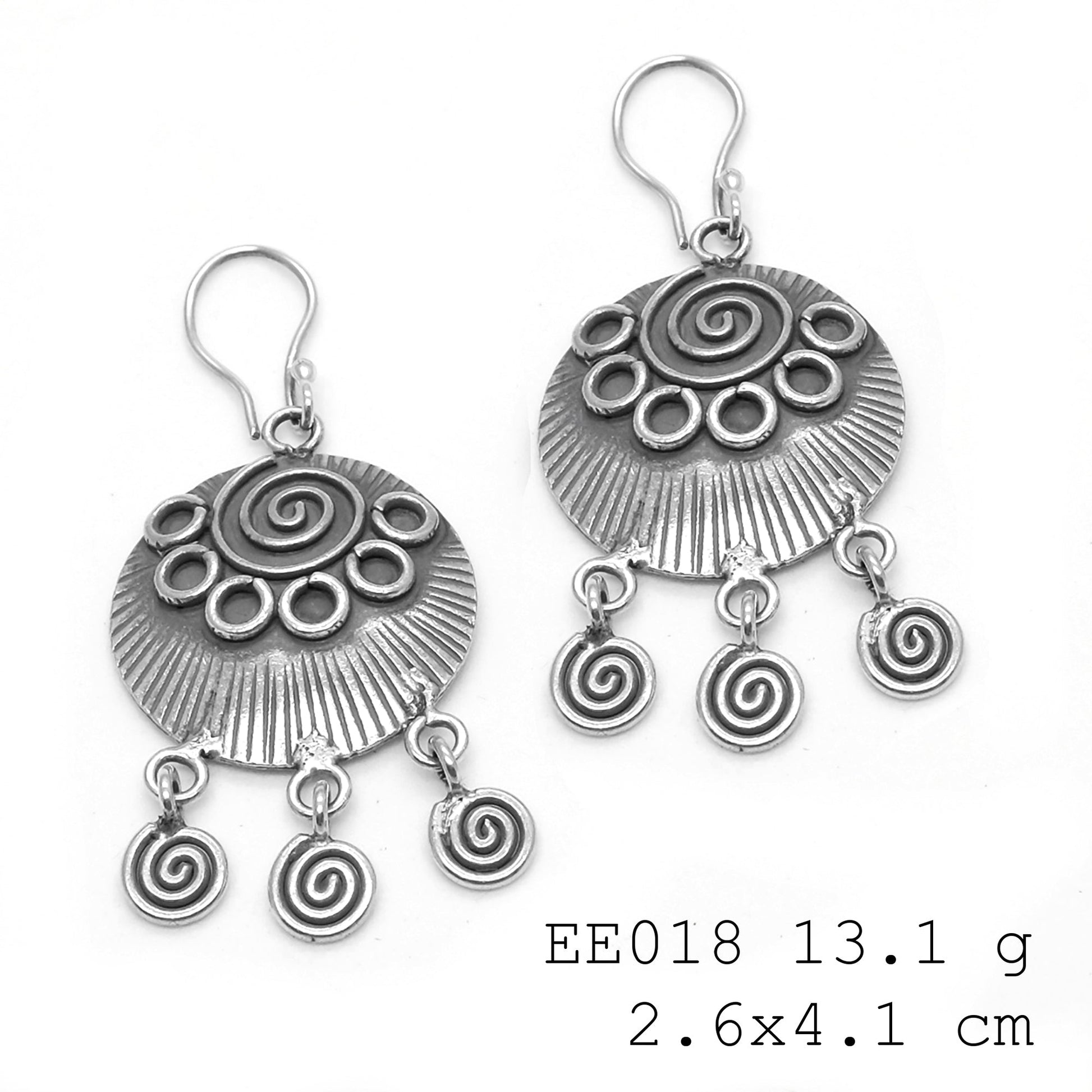 Fashion forward with spiral silver earrings.