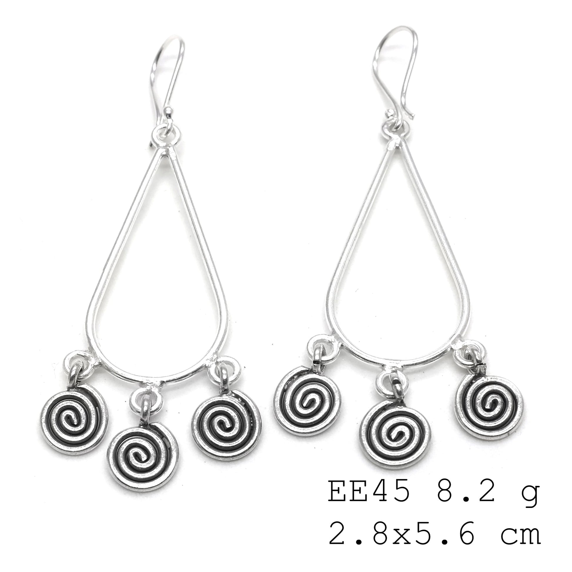 Adding an artistic edge with these coil silver earrings.