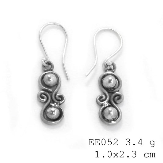 Modern art meets jewelry. Check out these coiled silver earrings.
