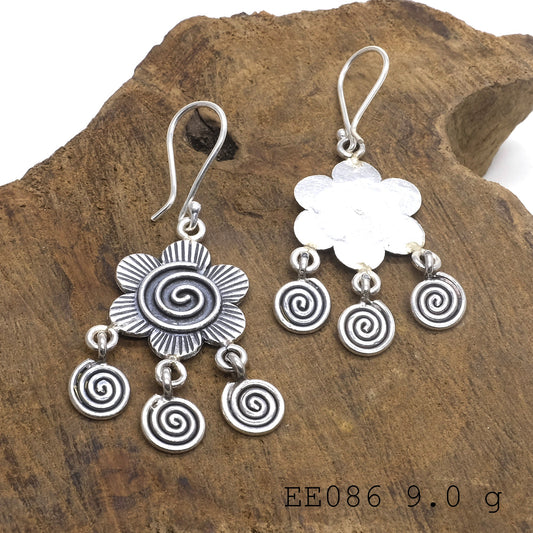 Where simplicity meets structure. These coil silver earrings are perfect.