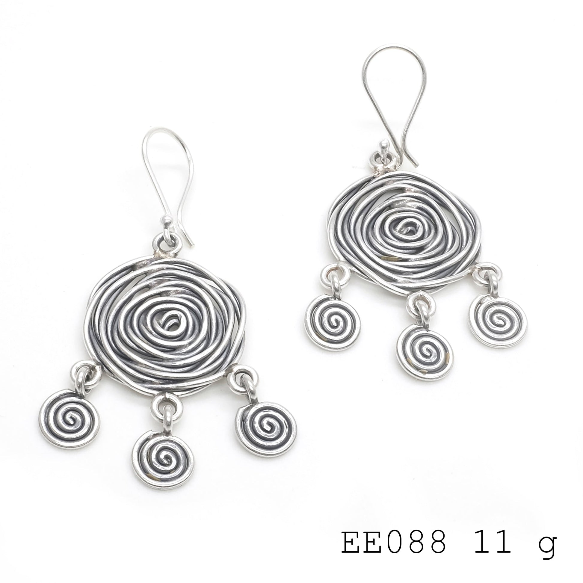 Curvy and chic. The ultimate silver earrings accessory.