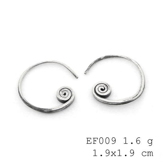 Get caught in the beautiful motion of these spiral silver earrings.