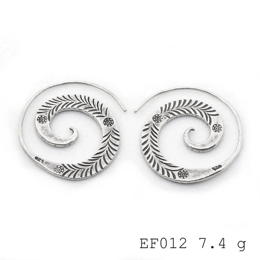 Hypnotic design, effortless elegance. These silver earrings are magic.
