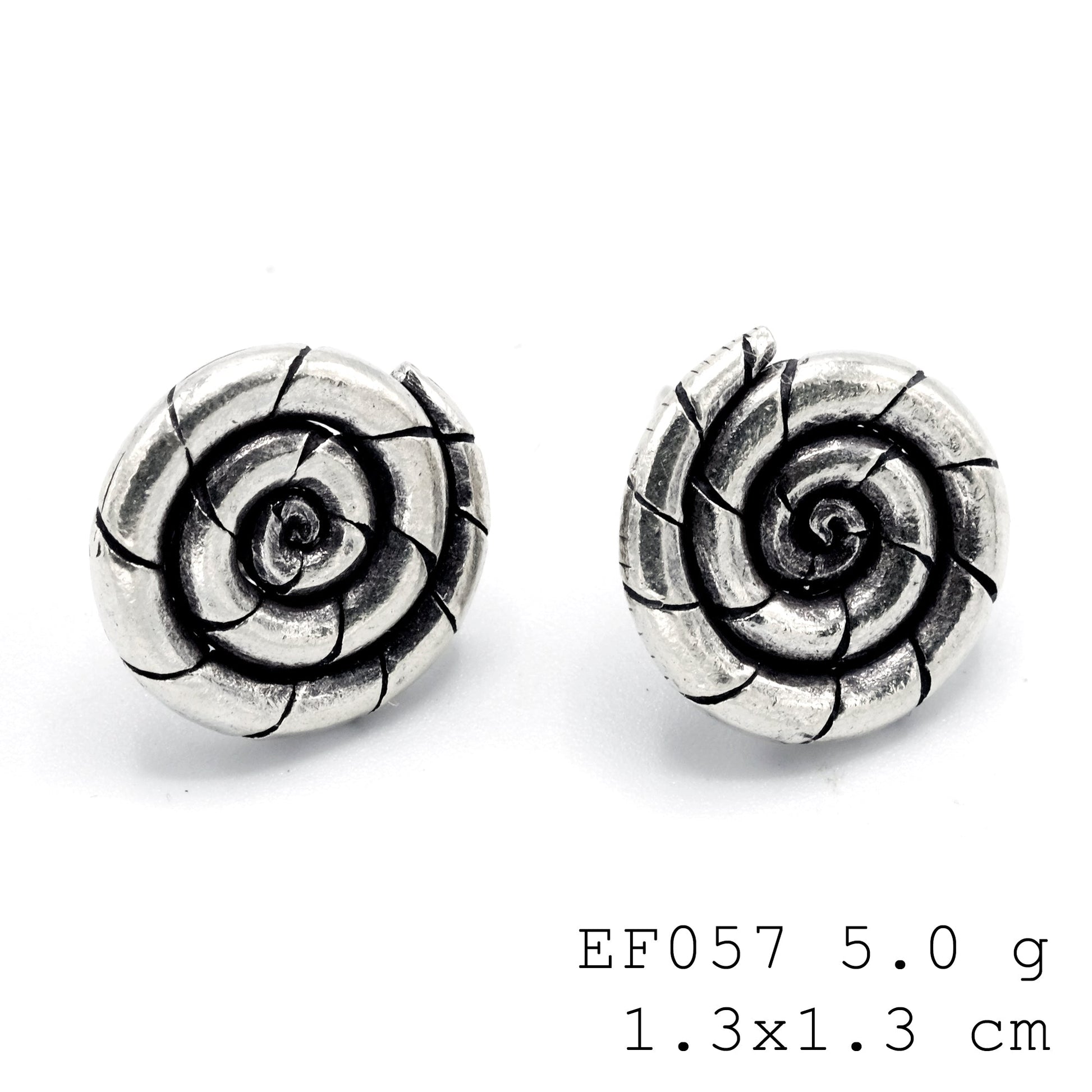 Polished, playful, and purely silver. Adore these spiral silver earrings.