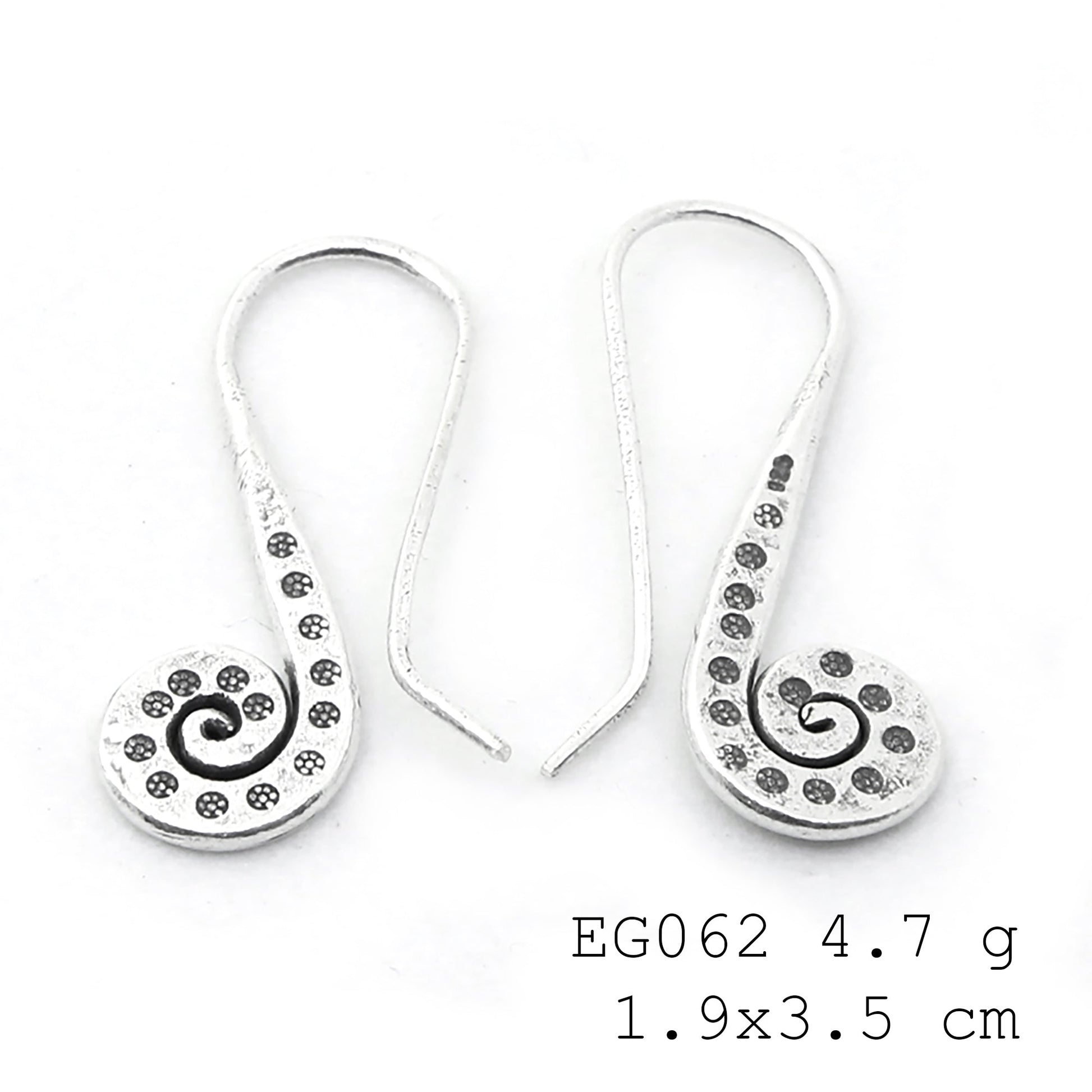 The art of the hang: handmade silver earrings.