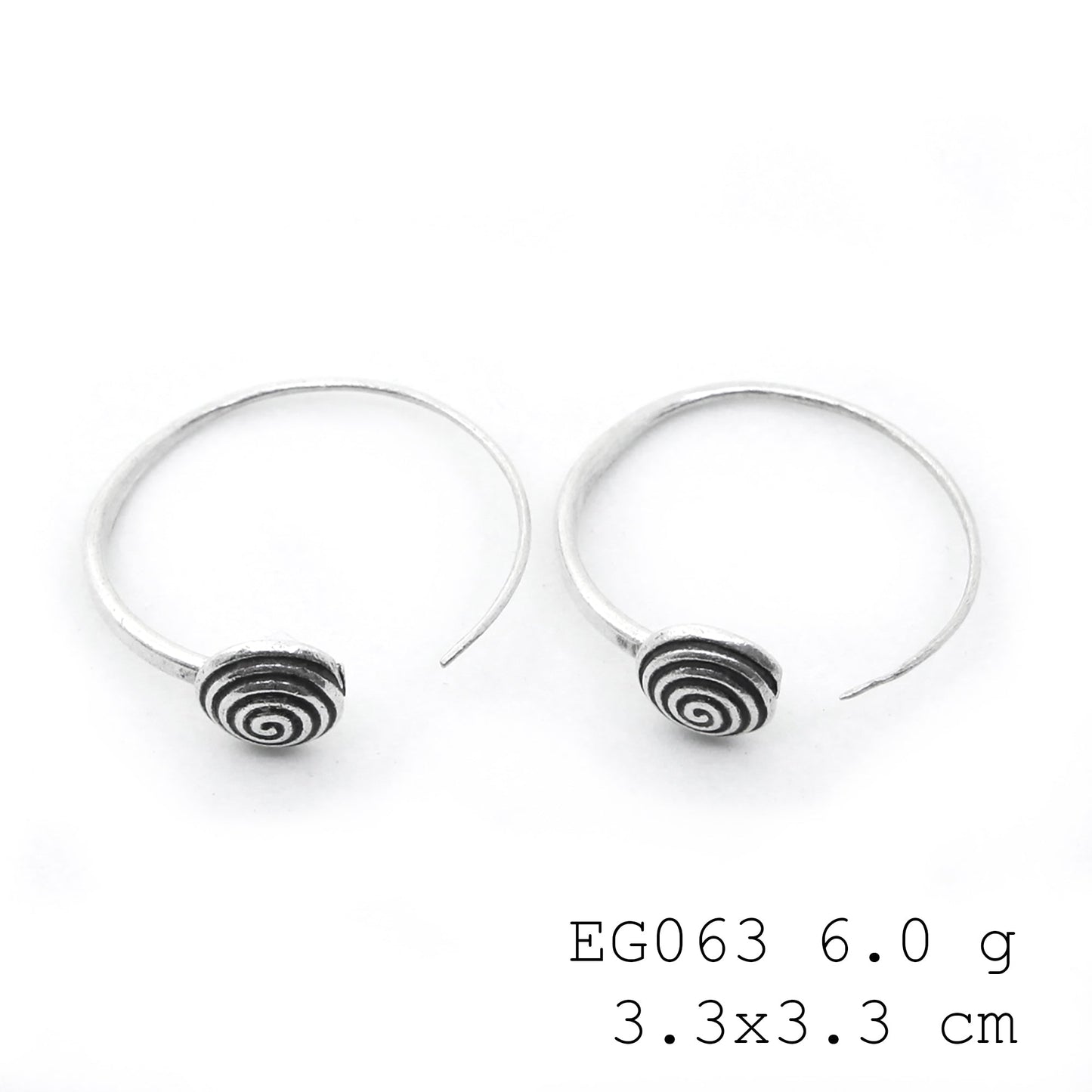 Subtle shine, bold silver earrings.