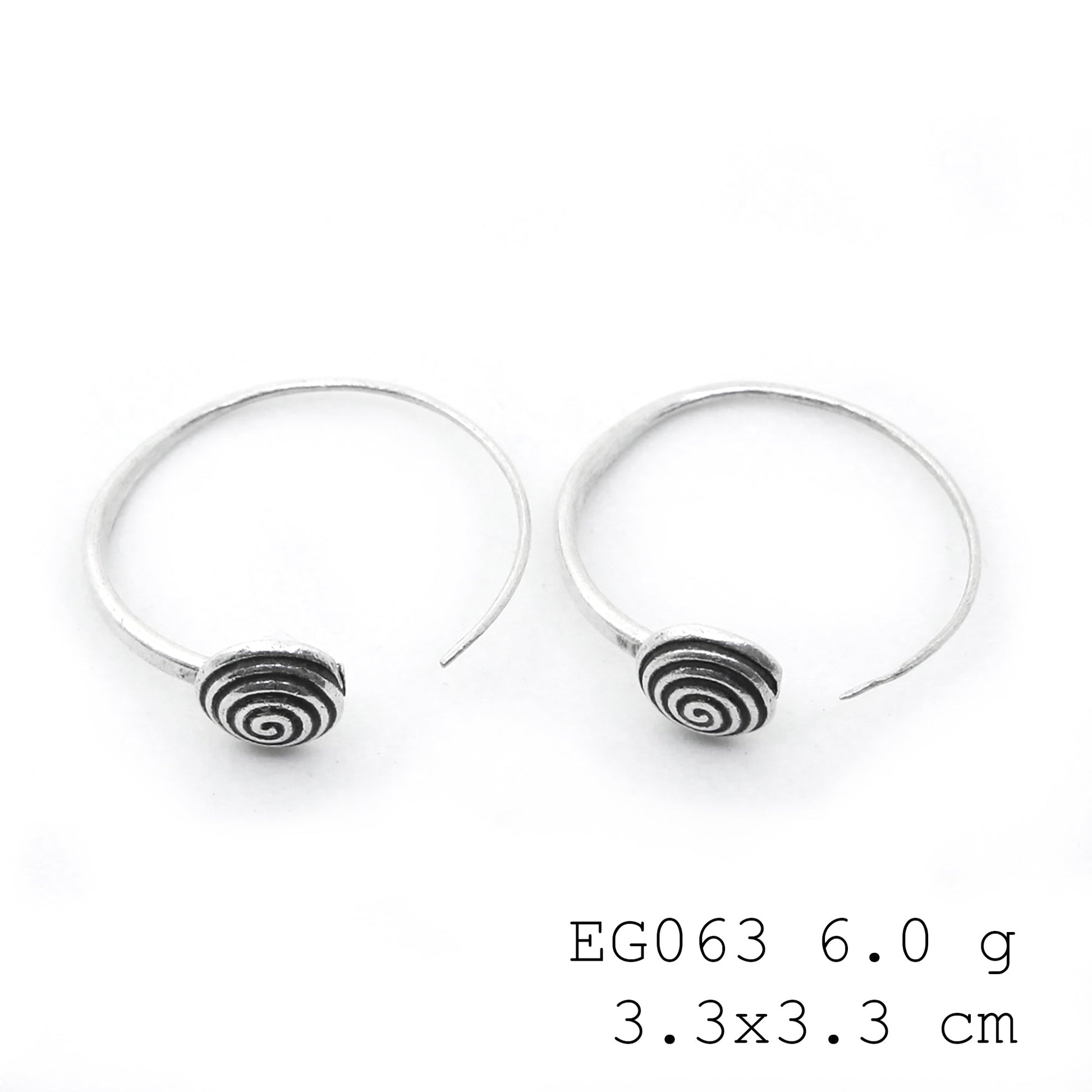 Subtle shine, bold silver earrings.