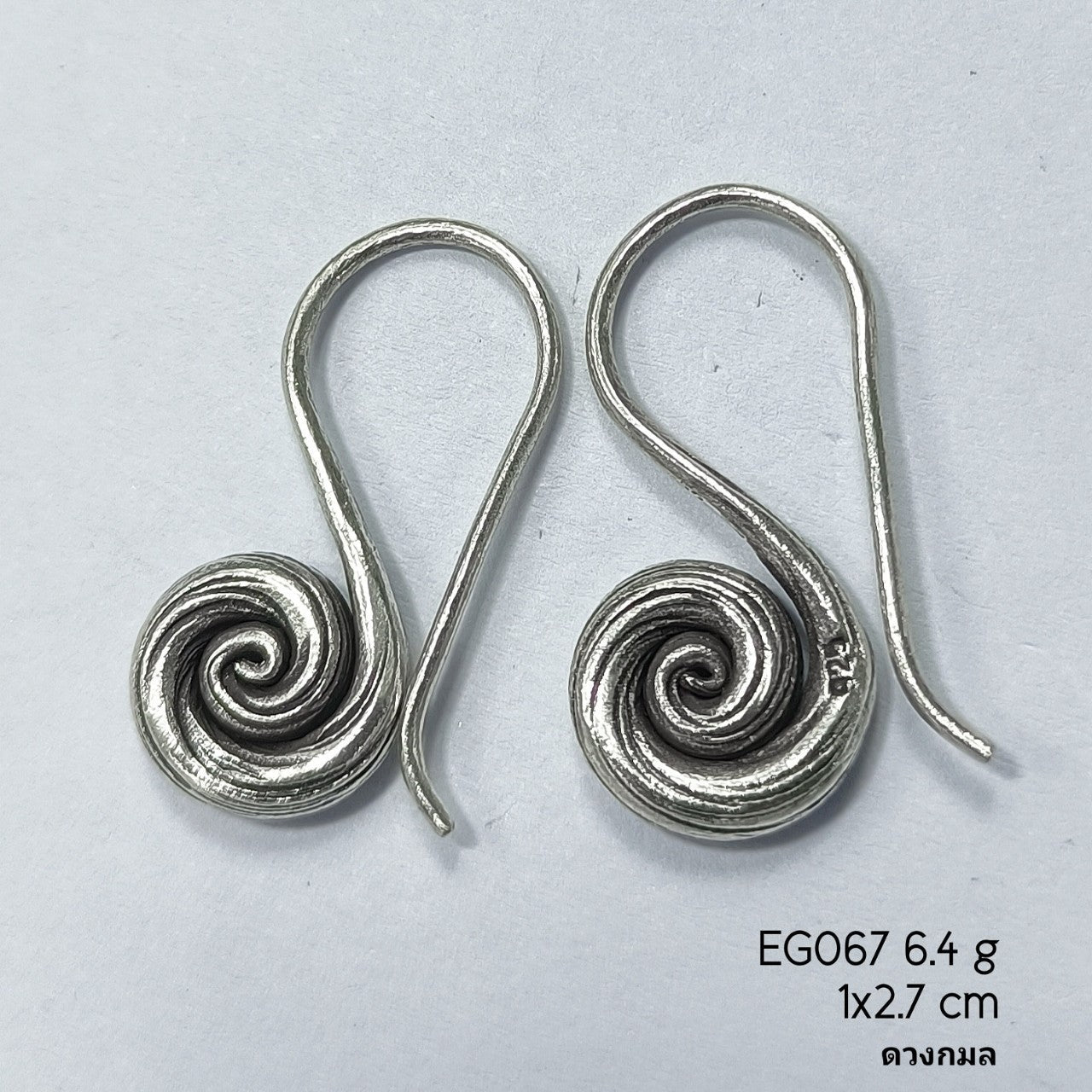 Modern geometry meets silver earrings.