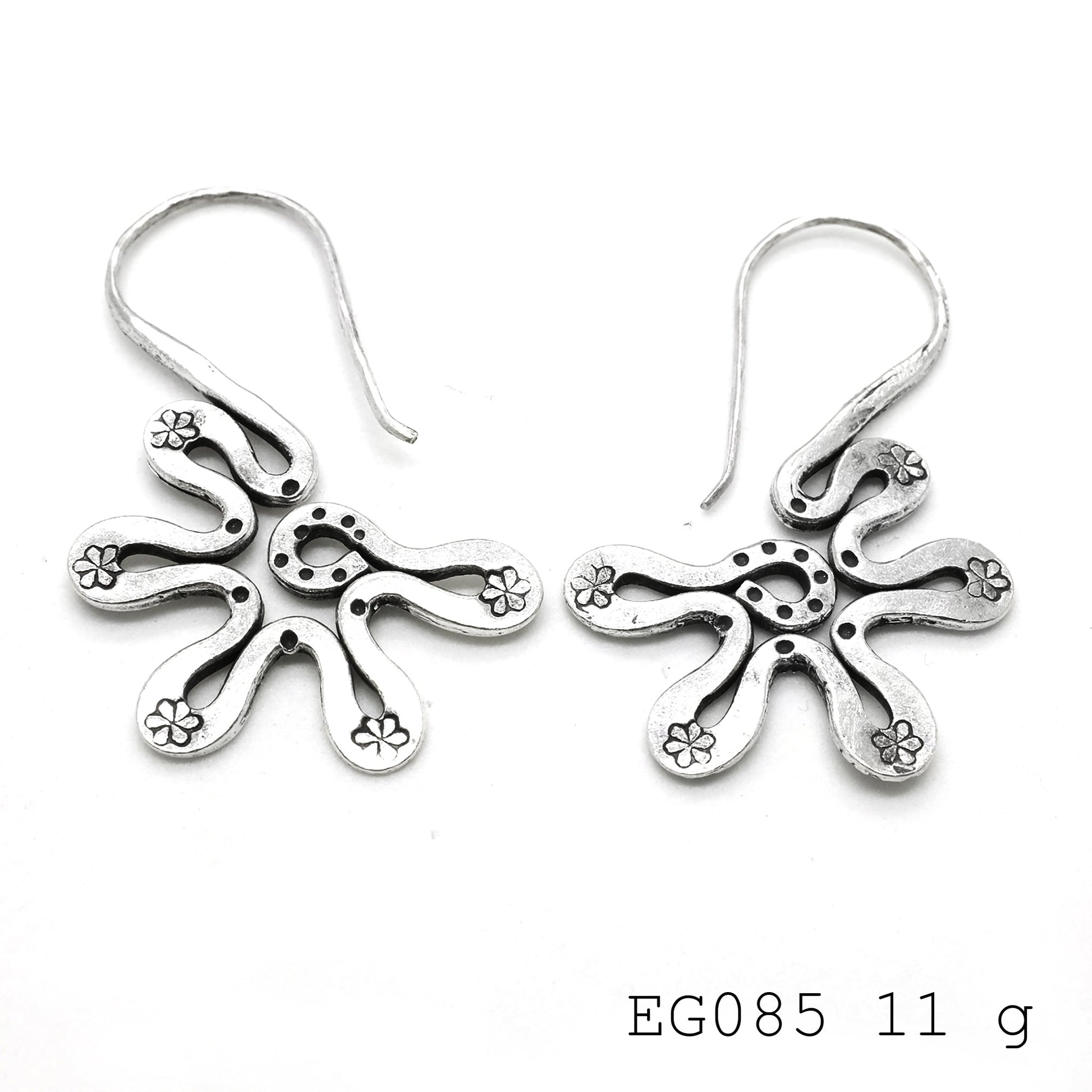 Your outfit’s best friend: silver earrings.