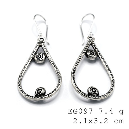 Refined grace in silver earrings.