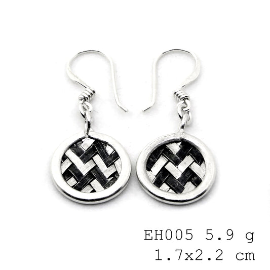 A classic twist on handmade silver earrings.
