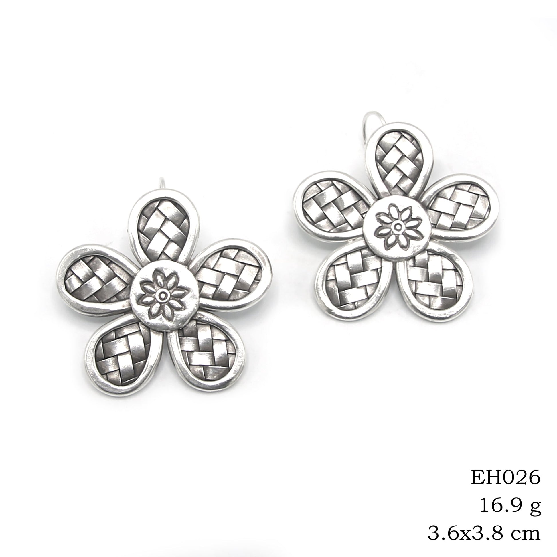 Sophisticated weaves meet pure silver earrings.