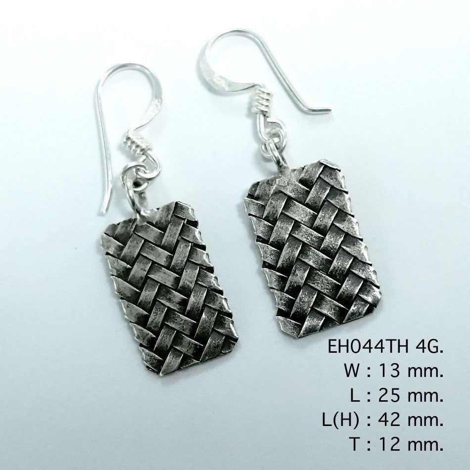 The art of the weave: handmade silver earrings.