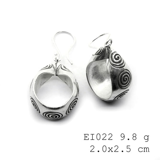 Small bags, big statement: handmade silver earrings.