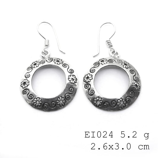 Carry a little style with these bag-shape silver earrings.