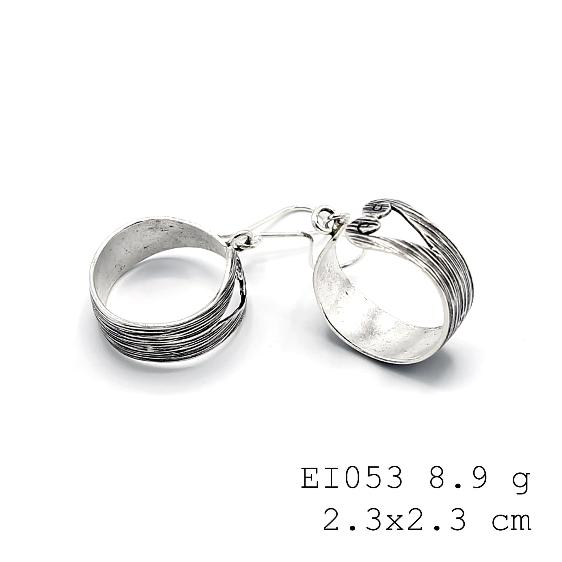 Hand-sculpted bag silhouettes in pure silver earrings.