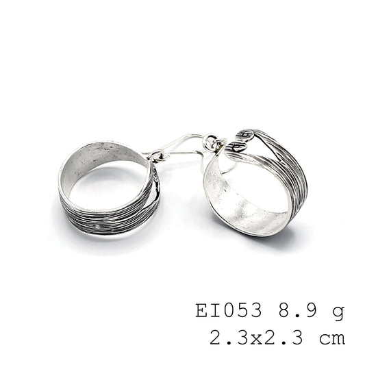 Hand-sculpted bag silhouettes in pure silver earrings.
