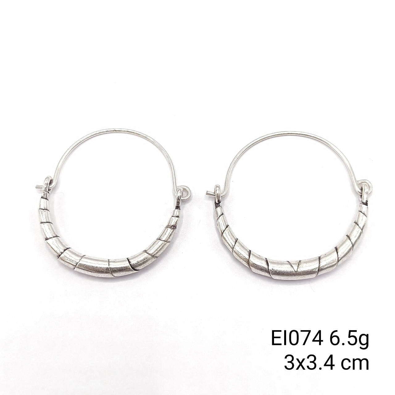 One-of-a-kind bag-shape silver earrings just for you.