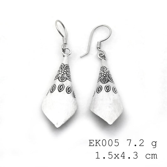 Hand-forged funnel designs in pure silver earrings.