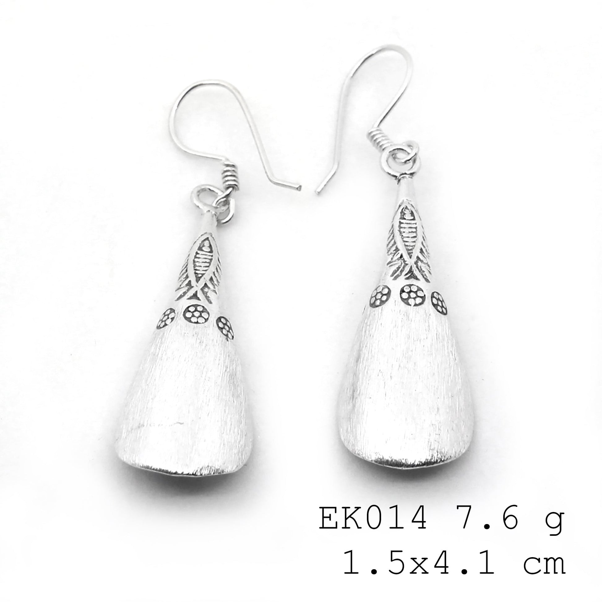 Minimalist drama with these pure silver earrings.
