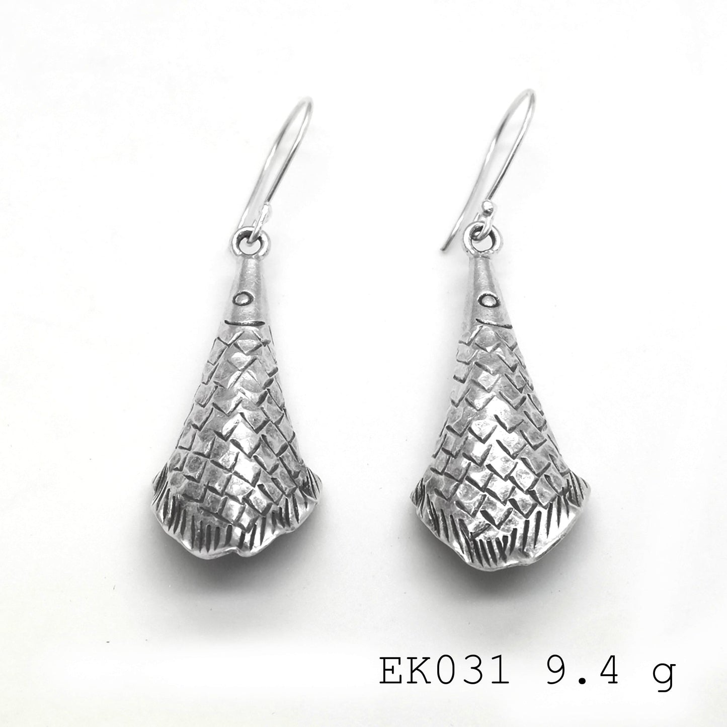 Subtle volume, bold style: funnel silver earrings.