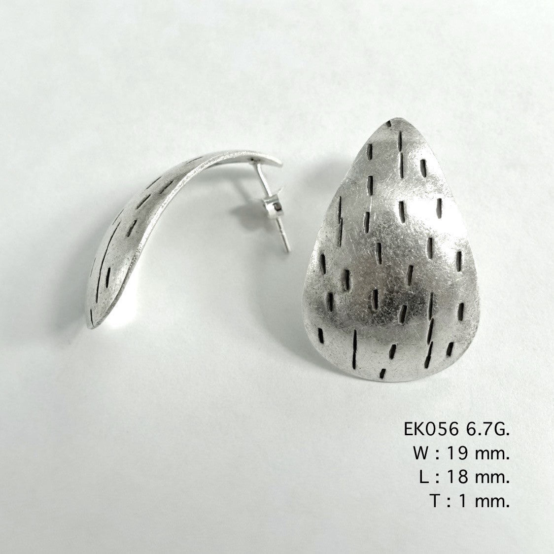 Modern silhouettes meet handmade silver earrings.