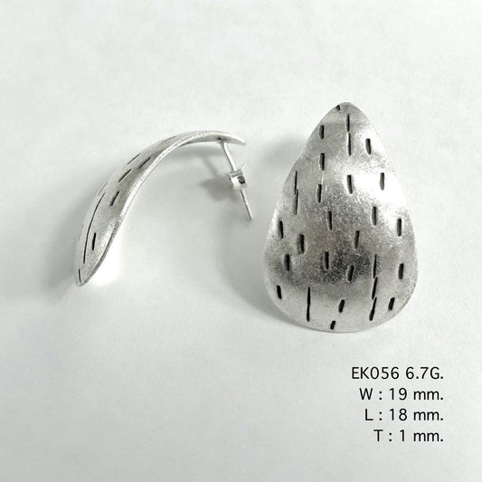Modern silhouettes meet handmade silver earrings.
